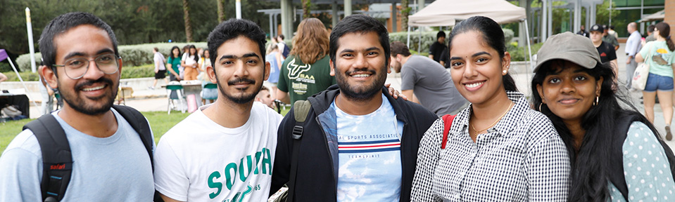 Five USF students at a campus event.
