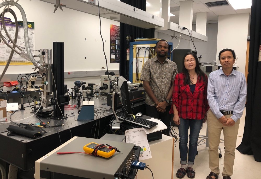 (From left) Emmanuel Olawale, graduate student, Dr. Xiaomei Jiang, associate professor, and Dr. Xuan Chung Nguyen, postdoctoral researcher, in the spintronic device research lab. (Photo courtesy of Dr. Xiaomei Jiang)