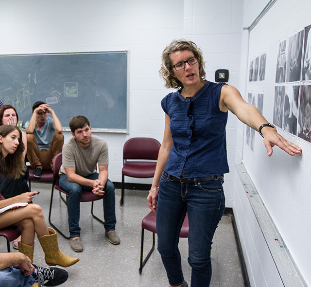 An art professor and her students participating in a photography project evaluation in the USF School of Art & Art History.