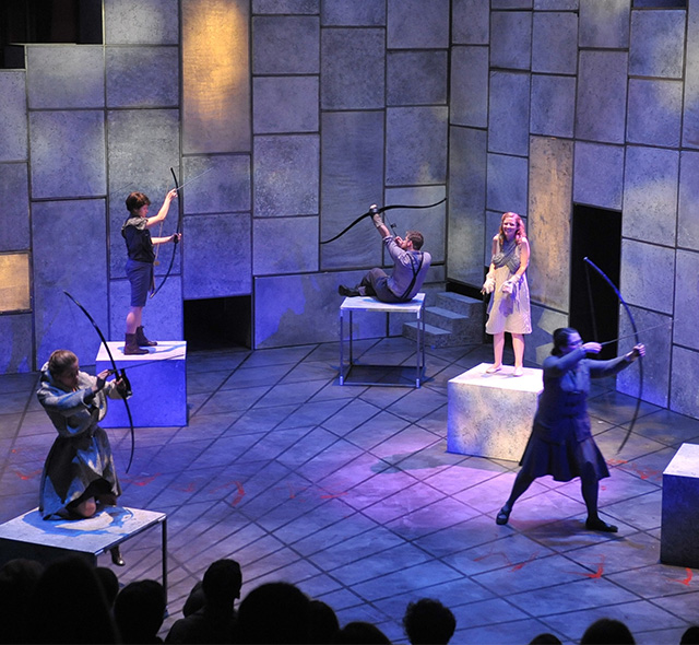A completed set and lighting design during a performance in USF Theatre 2.