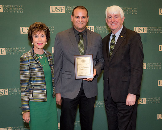 USF President Judy Genshaft, Professor Baljinder Sekhon, and Provost Ralph Wilcox pose for a photo at the 2017-2018 Faculty Honors & Awards Reception