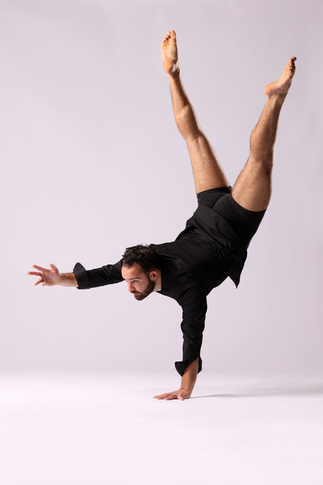 Jackson Haborak standing on one hand in a dance position.