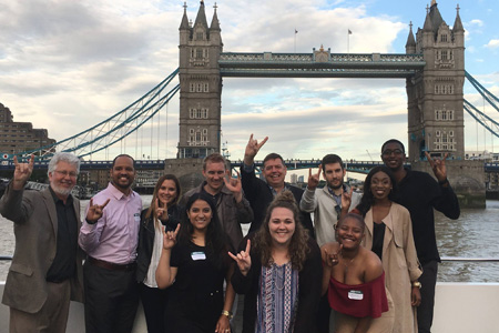 Students show their bulls pride in front of the tower bridge in London.
