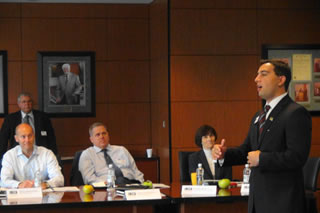 Charles Poliseno speaks to business executives about his experience in the Citi seminar. 