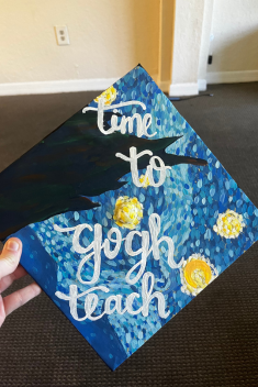 A painted grad cap in the style of Van Gogh's Starry Night with the worsd: "Time to Gogh Teach"