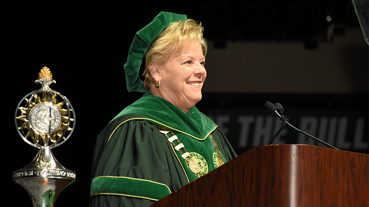 USF President Rhea Law speaks at a podium during Commencement