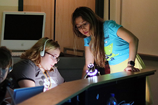 VSA Florida Animation Instructor Dani Bowman works with a student as they create their own animation movie.