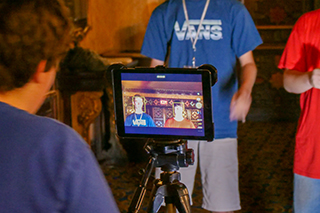 student recording a video on an ipad