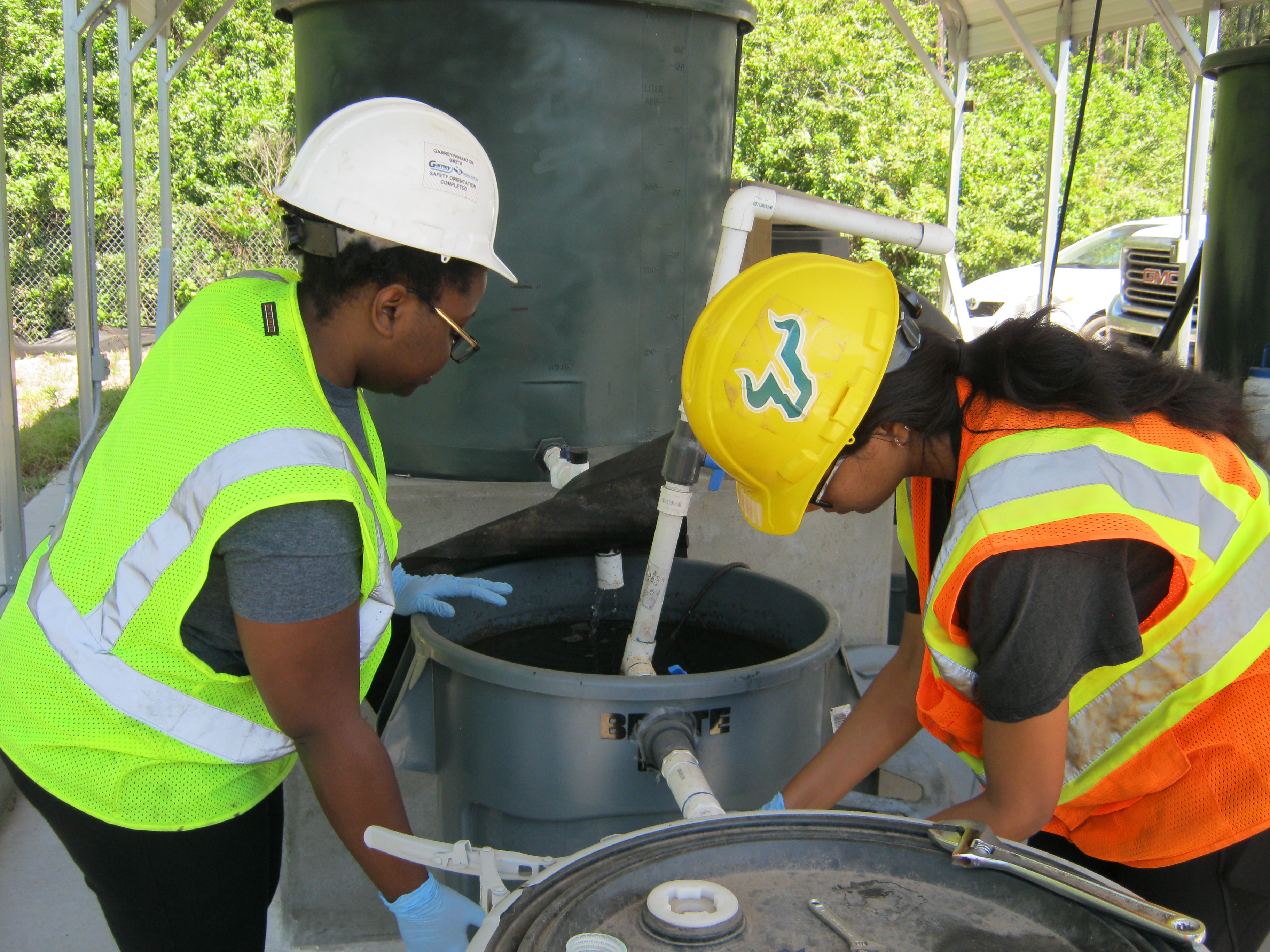 Students and faculty work on a CEE wastewater treatment site