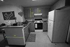 Kitchen dimensions. Cabinets above sink are 30 inches tall, cabinets above exhaust fan is 18 inches tall. Kitchen sink side is 34 inches wide. 