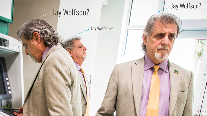 Jay Wolfson posed in a variety of positions in a suit talking about identity theft.