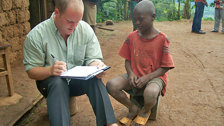 Stephen Cormier sharing his knowledge to a young boy about HIV/AIDS