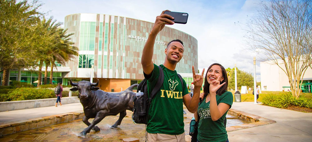 USF students taking pictures outside of Marshall Center.
