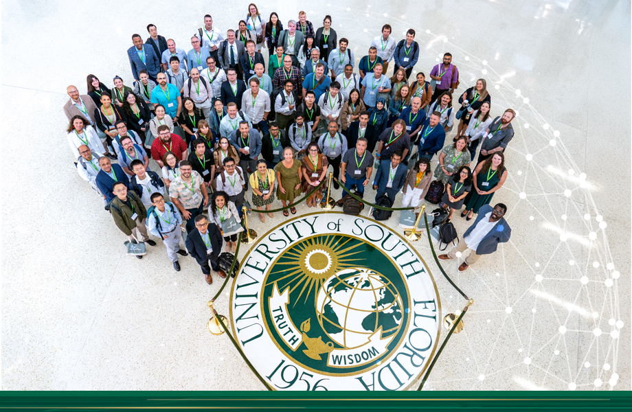 group of people next to usf seal