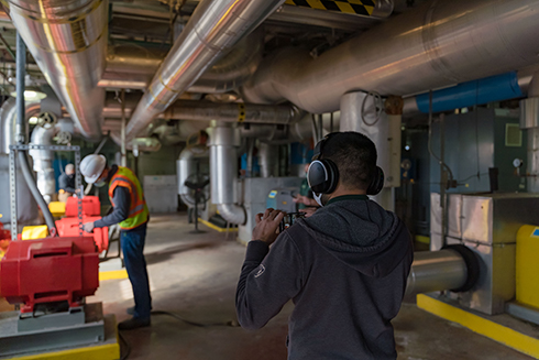 Hari Patel streams a tour of the Facilities Management Chiller Plant while answer questions on Microsoft Teams.