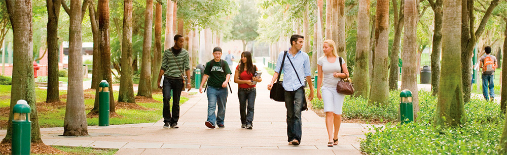Pedestrians walking on campus at USF.