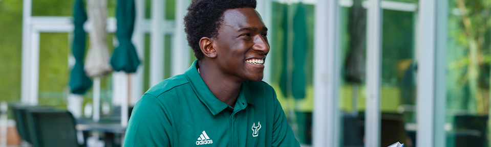 A male USF student smiling.