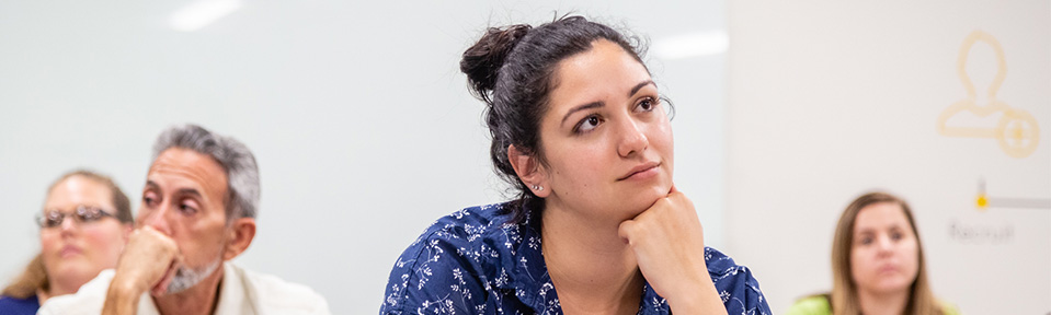 Graduate students attending a class.