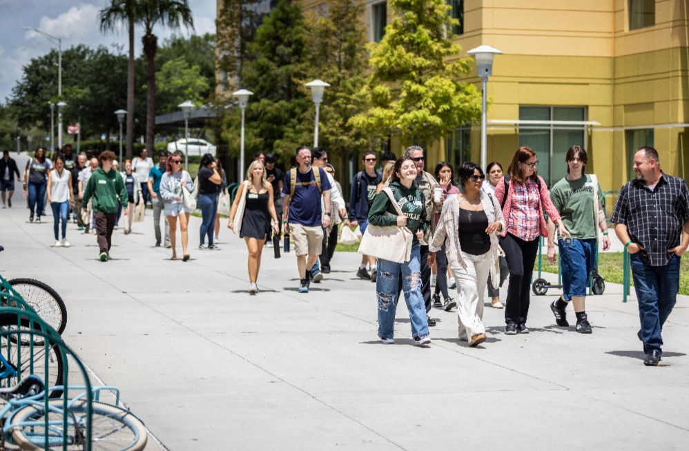 A group of students and parents during a USF campus tour.