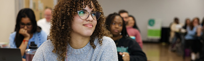 A USF student smiling during class.