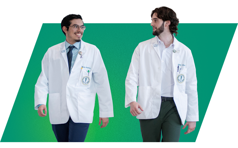 Two USF Health students chatting and walking.