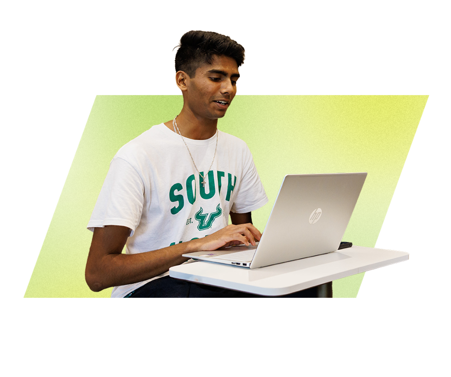 A USF student using a laptop