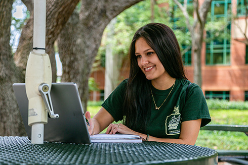 Young woman looking at her computer