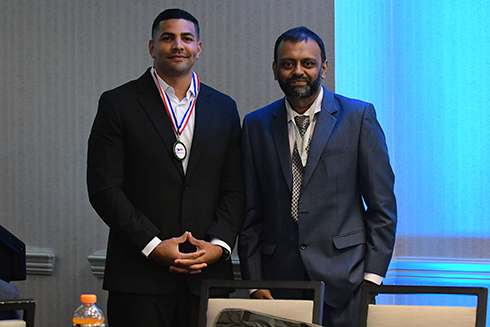 Student voted most valuable debater with professor