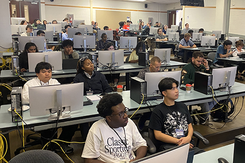 Students sitting at computers at the TechX Florida Conference