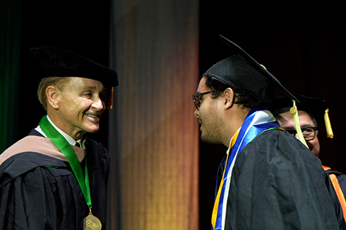Entrepreneur and philanthropist Arnie Bellini was honored with USF’s President’s Fellow Medallion during graduation exercises.