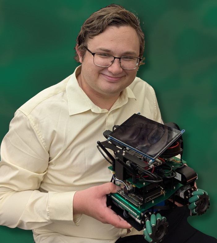 Young male engineer in a cream dress shirt holding a custom-built robotics project with omni-directional wheels and a mounted touchscreen interface, showcasing innovative student technology and robotics engineering. Ideal for STEM education, university research, and advanced electronics projects.