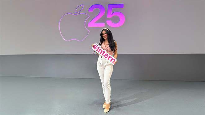 Woman in front of Apple signage