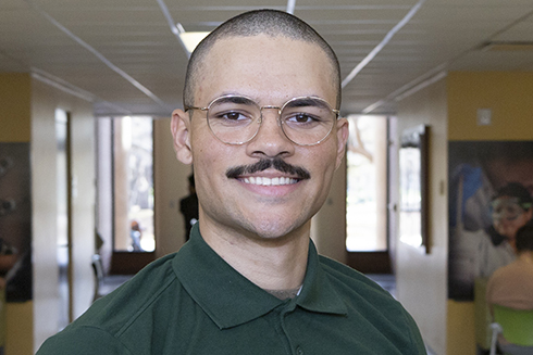 Jacob Sotel-Jackson smiling in the engineering building on the USF campus.