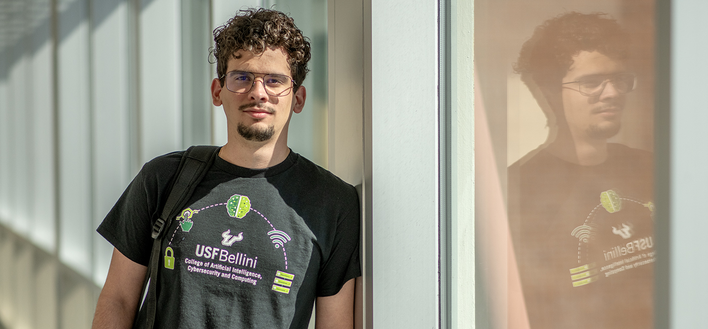 Cristian Hernandez stands in the hallway of the Engineering Building on the USF campus.