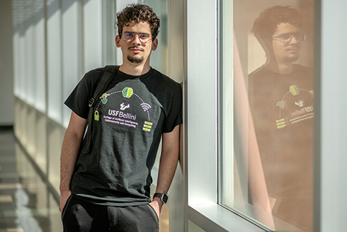 Cristian Hernandez stands in the hallway of the Engineering Building on the USF campus.