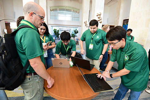 Marbin Pazos-Revilla with members of the USF CyberHerd team
