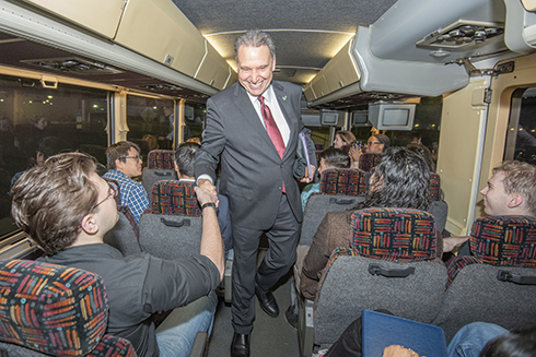 USF President shakes hands with students