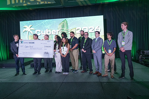 University of South Florida students and the university president accept an oversized check from Peter Bellini of connect secure.