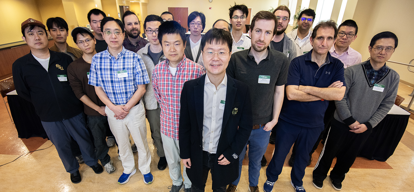 Jiajun Huang, center, is an assistant professor in USF’s Bellini College of Artificial Intelligence, Cybersecurity and Computing, who brought together experts to explore emerging technologies that enable researchers to process, store and analyze massive scientific datasets more efficiently at the FZ-ZF Joint Workshop at USF.