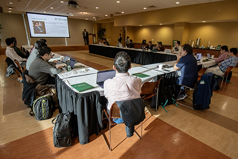 Researchers listening to workshop