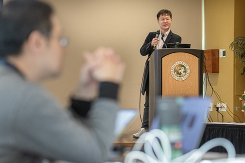 Jiajun Huang, on the right, is an assistant professor in USF’s Bellini College of Artificial Intelligence, Cybersecurity and Computing, who brought together experts to explore emerging technologies that enable researchers to process, store and analyze massive scientific datasets more efficiently at the FZ-ZF Joint Workshop at USF.