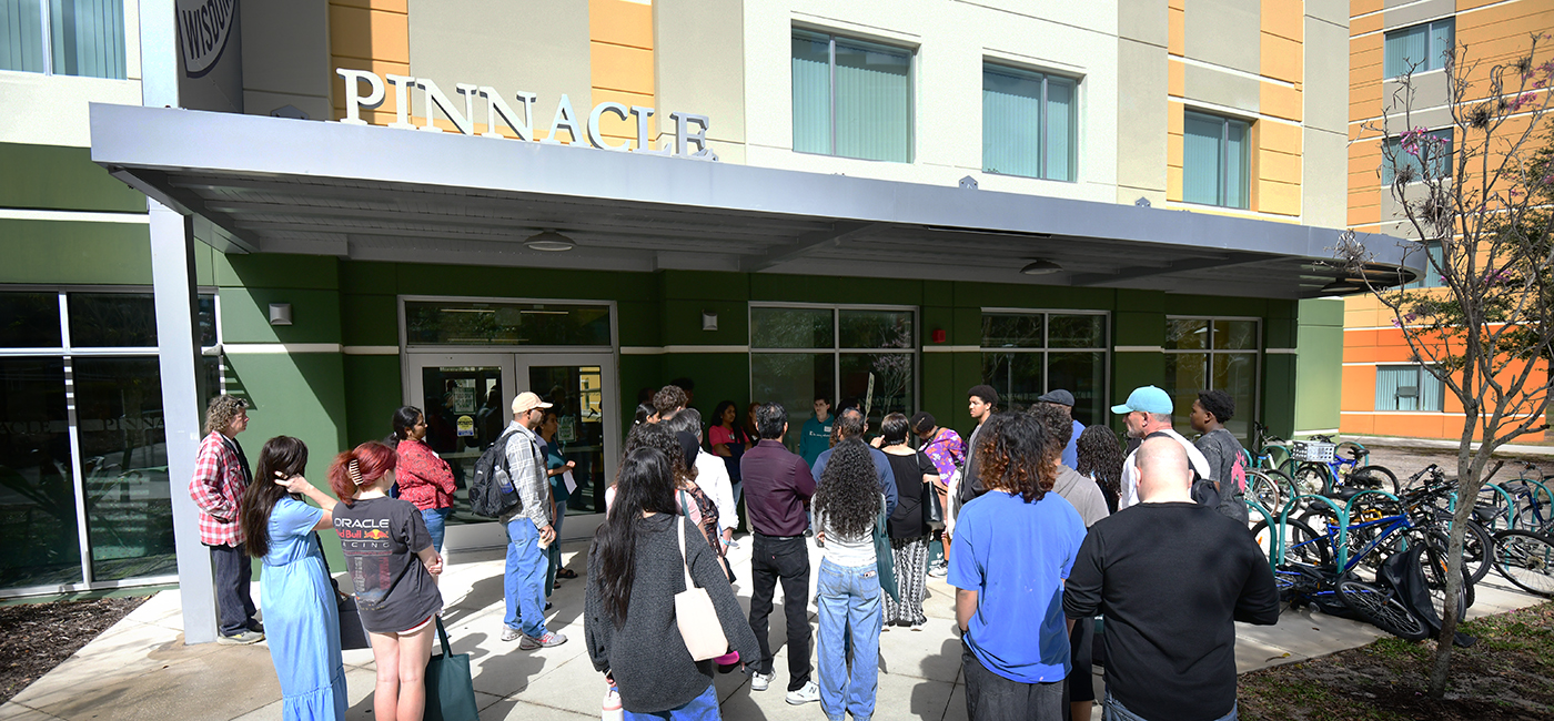 Parents and incoming students tour the new living learning community at the Bellini College.