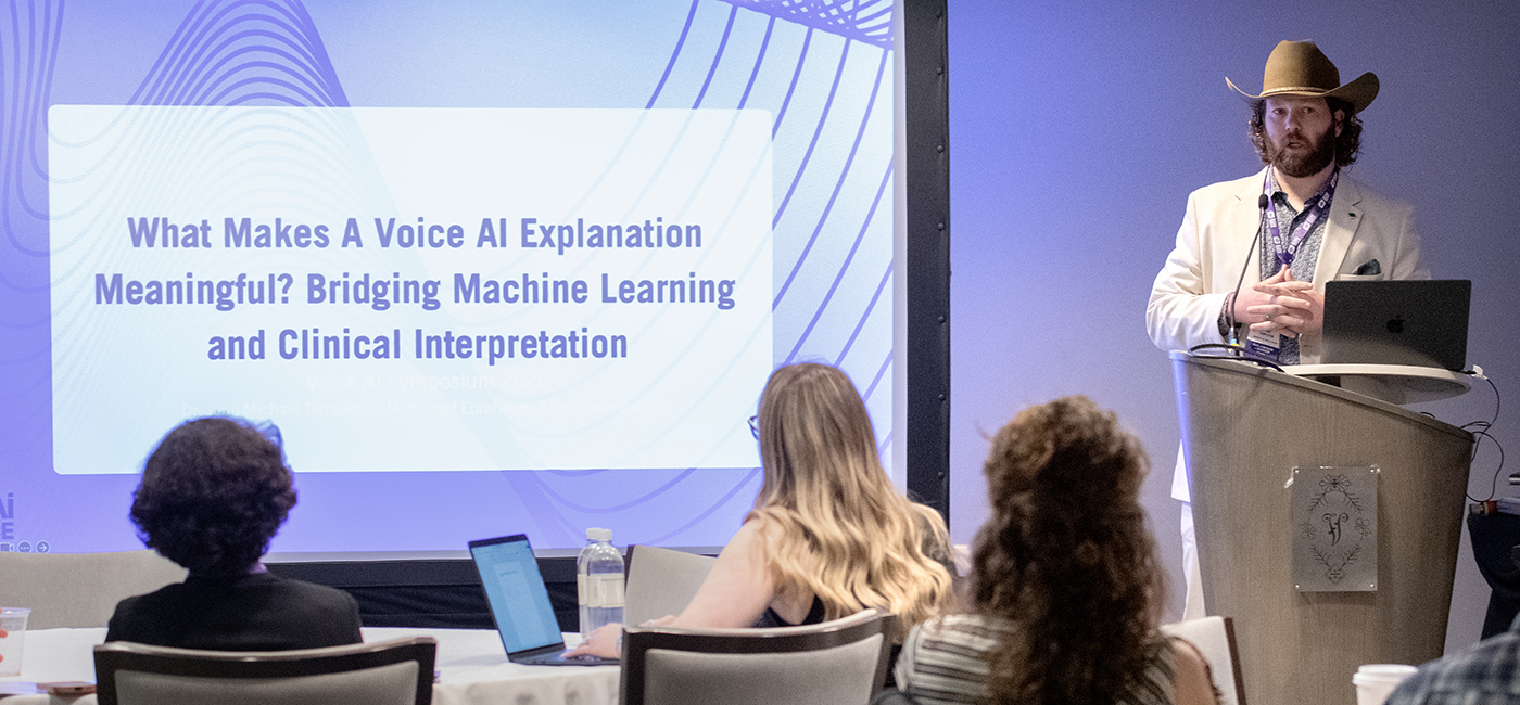 Assistant Professor John Templeton speaks to workshop attendees at the Voice AI Symposium.