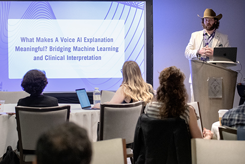 Assistant Professor John Templeton speaks to workshop attendees at the Voice AI Symposium.