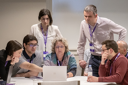A group at the workshop uses ai tools to analyze voice recordings.