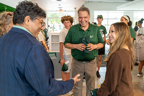 USF President Moez Limayem and Bellini Launch Dean Sudeep Sarkar welcome Alyssa Hayman to the new Living Learning Community.
