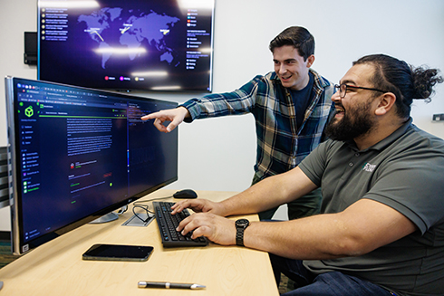 Two students working at a computer