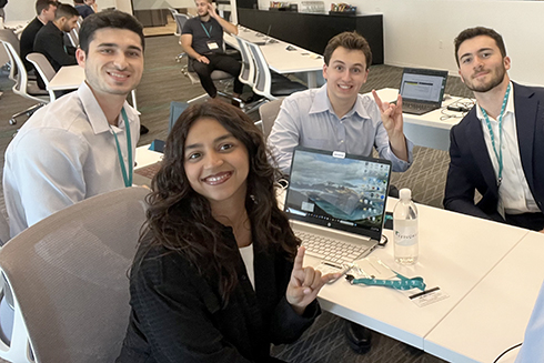 Karishma Tallreja at a table with other students.