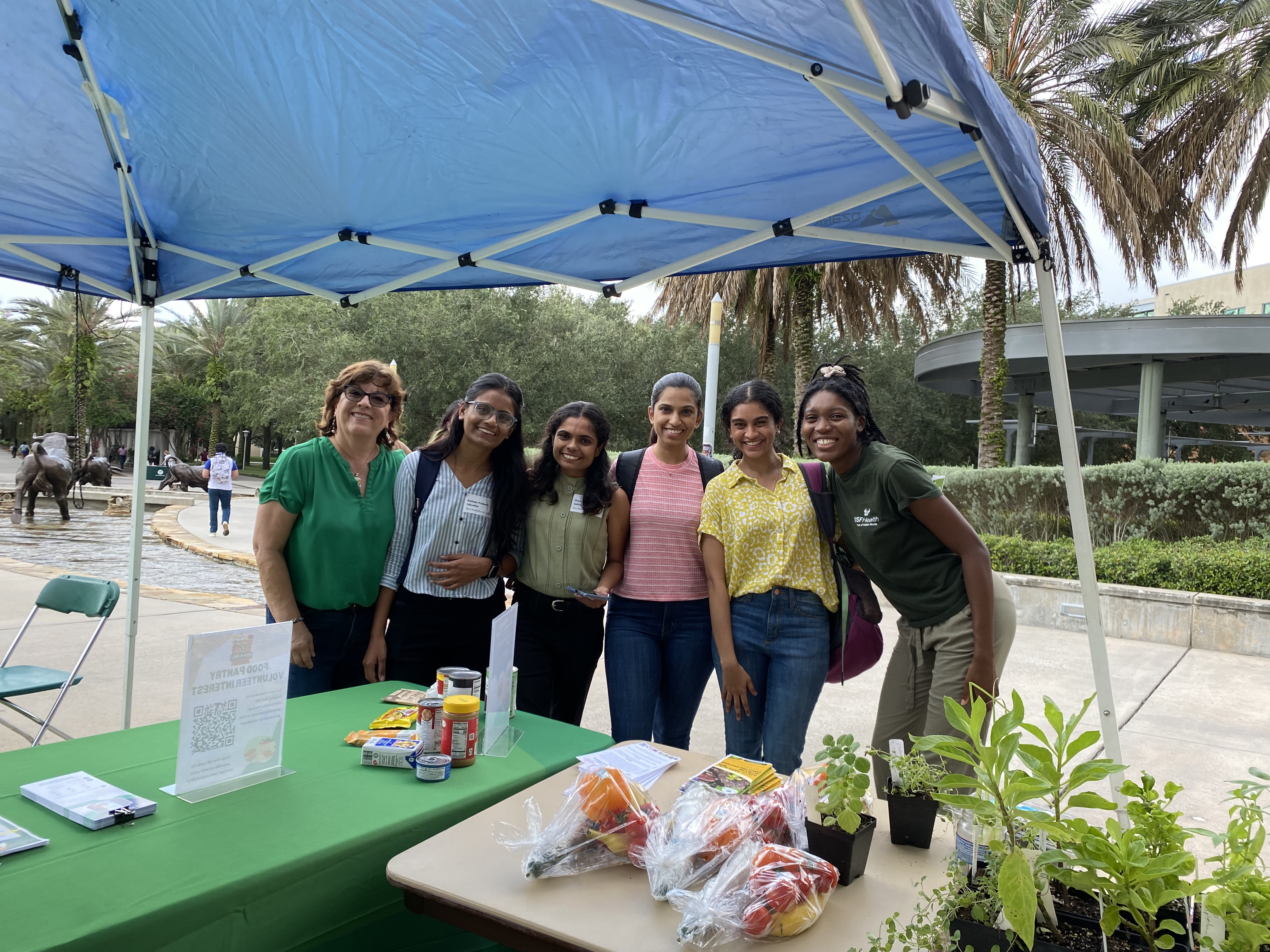 A group of students and CAFSHC employees standing and smiling