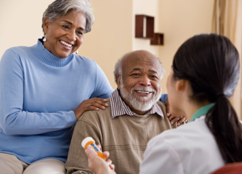 Older adults discussing health with a doctor